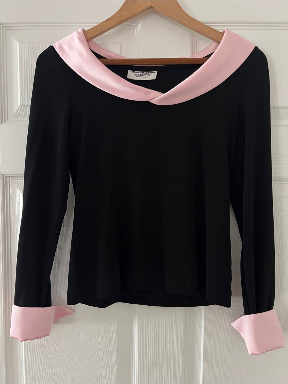 Elegant Black Top with Pink Collar and Cuffs